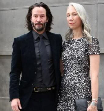 Emma Reeves brother Keanu Reeves with his girlfriend Alexandra Grant.